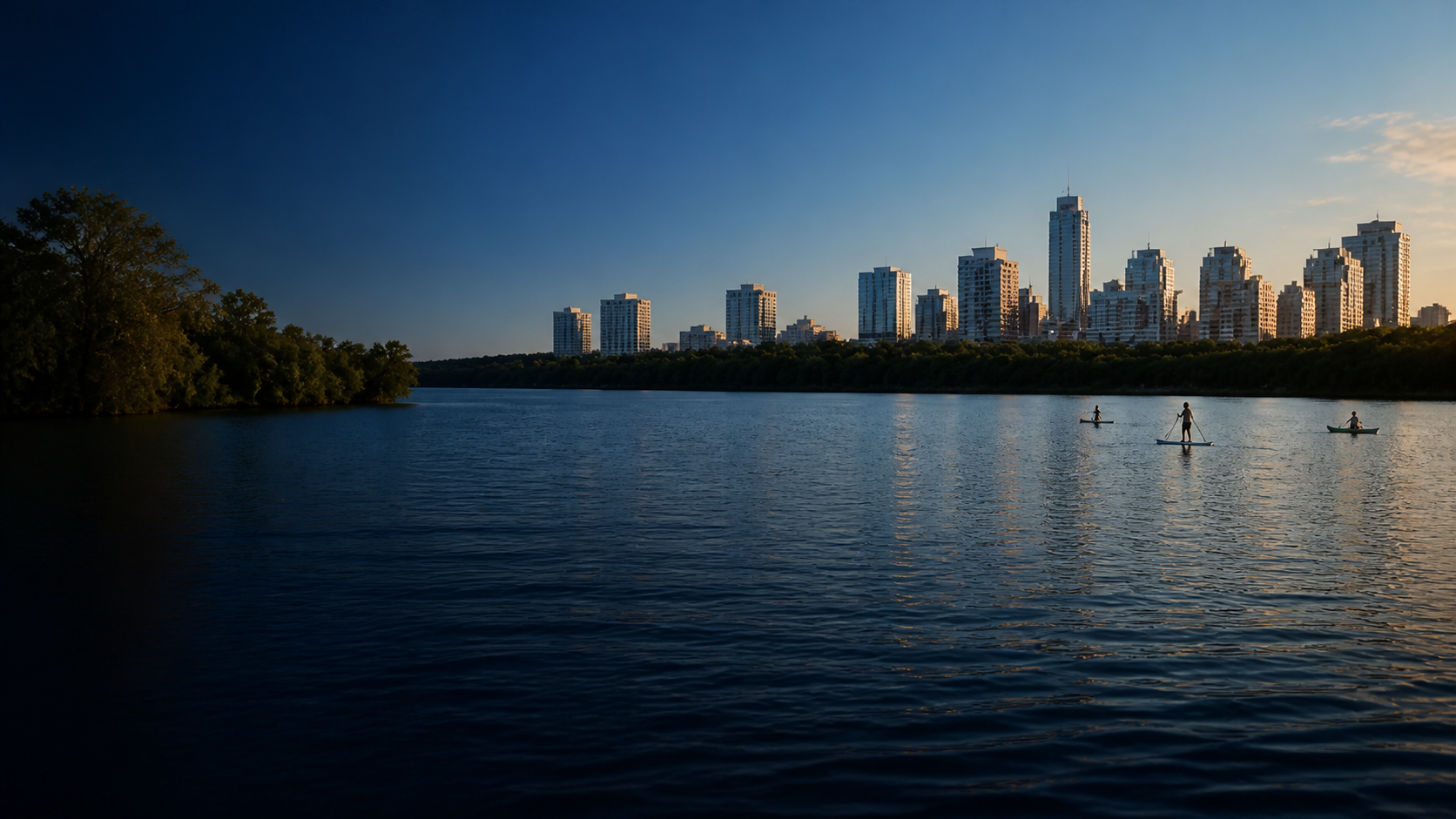 Austin skyline across calm lake water with paddlers