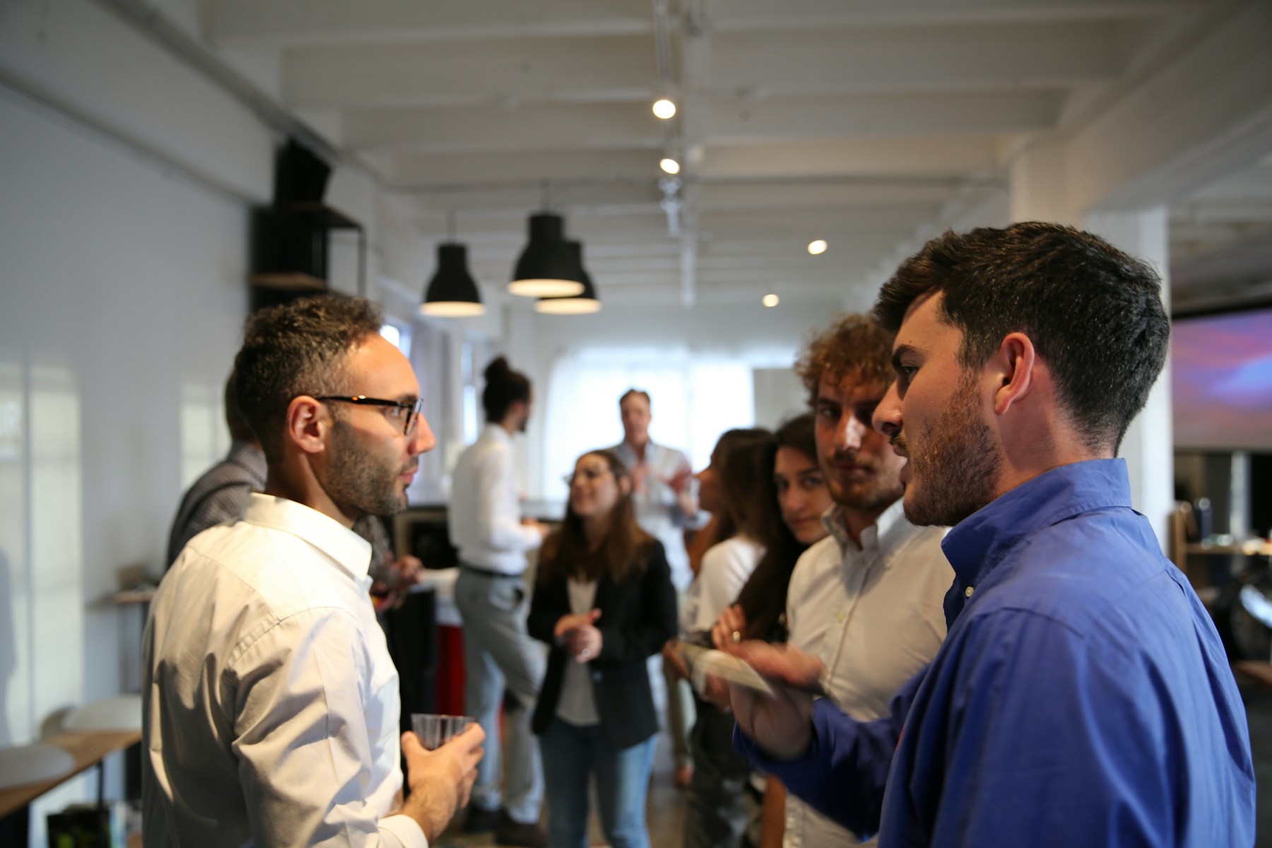 Conference attendees networking before a session